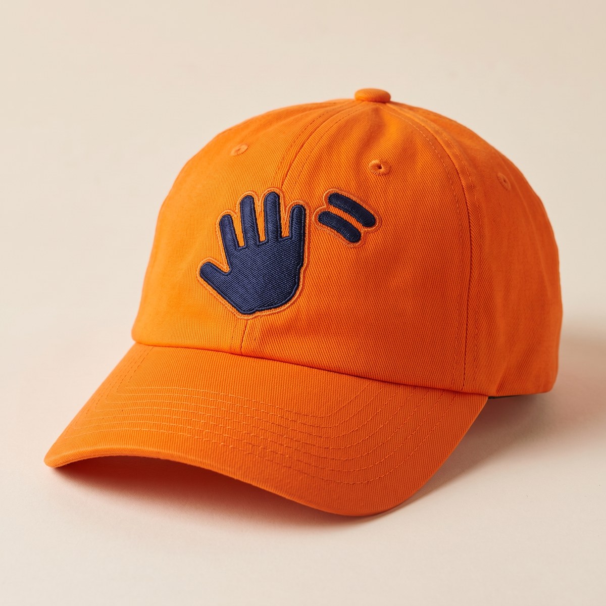 The WAVERS cap: unstructured, high-visibility Signal Orange, with the mark on the front panel